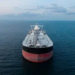 Oil tanker approaching the Strait of Hormuz, a critical global energy chokepoint.